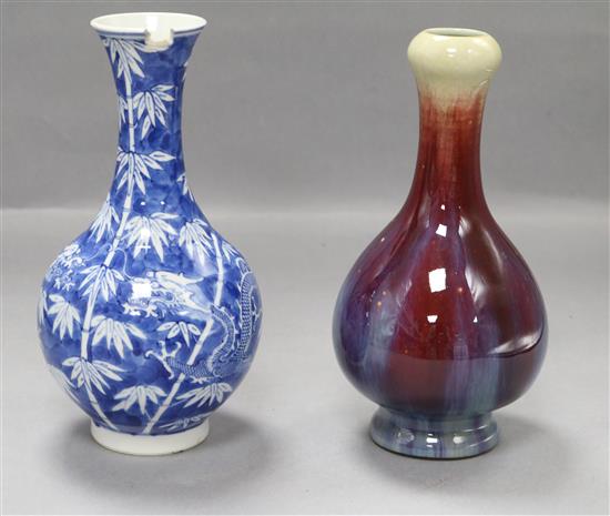 A Chinese blue and white dragon vase and a flambe vase tallest 22.5cm